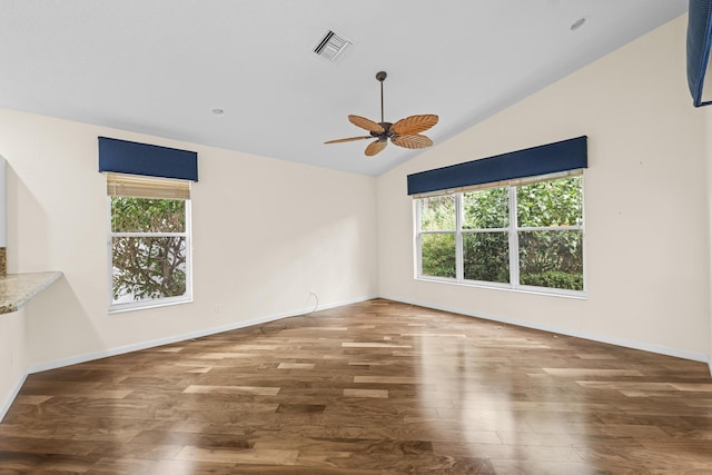 spare room with hardwood / wood-style floors, ceiling fan, and lofted ceiling