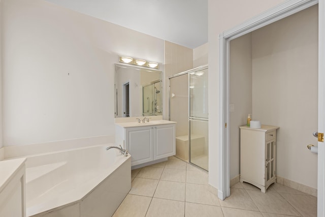 bathroom with tile patterned floors, vanity, and shower with separate bathtub