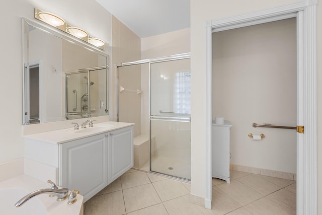 bathroom with tile patterned floors, vanity, and independent shower and bath