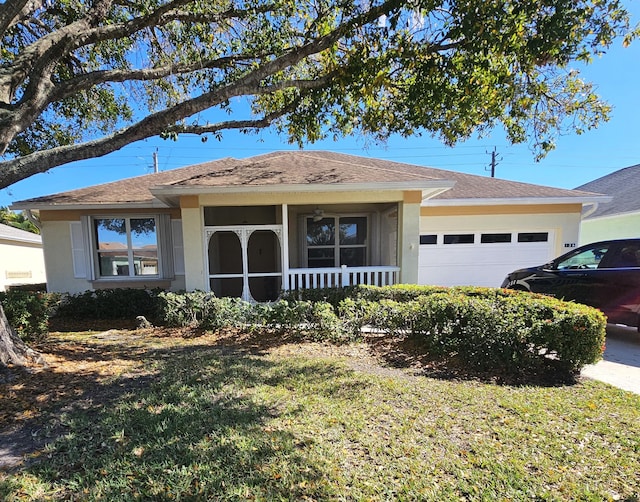 ranch-style home with a front lawn and a garage