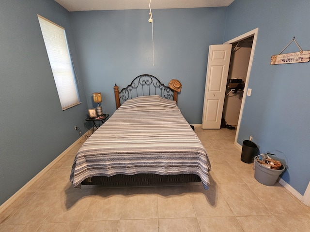 bedroom featuring light tile patterned floors