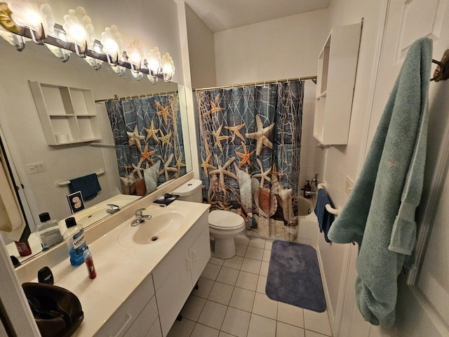 bathroom with toilet, tile patterned flooring, and vanity