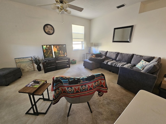 carpeted living room featuring ceiling fan