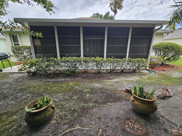 rear view of house with a sunroom