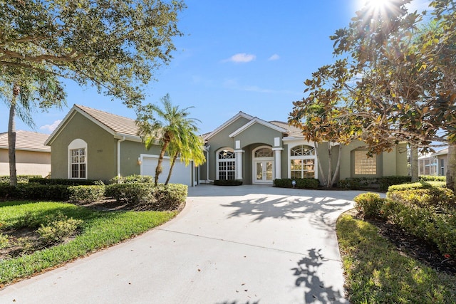 single story home featuring a garage