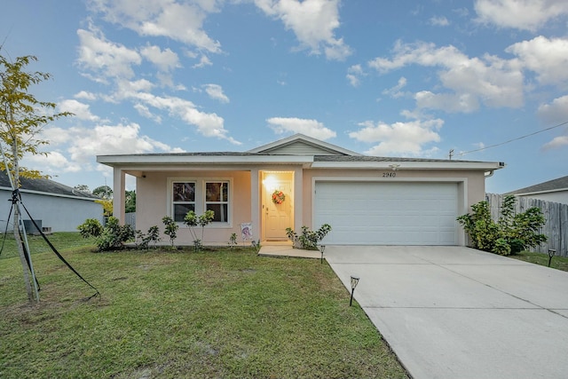 single story home with a front yard, a garage, and covered porch