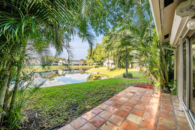 view of patio with a water view