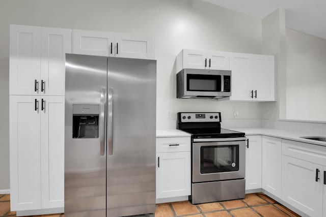 kitchen featuring white cabinets and appliances with stainless steel finishes