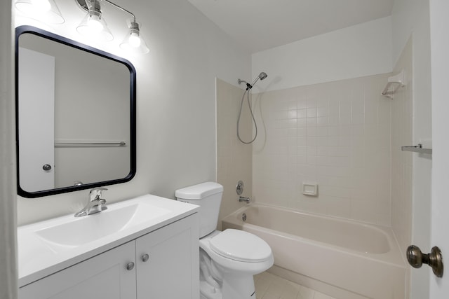 full bathroom with tile patterned floors, vanity, toilet, and tiled shower / bath combo