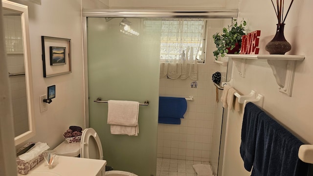 bathroom with vanity, toilet, and an enclosed shower