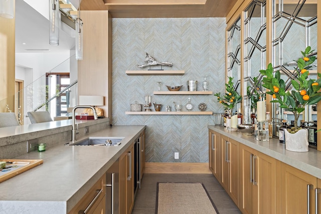 kitchen featuring dark tile patterned flooring and sink