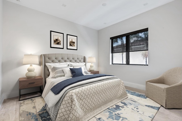 bedroom with light hardwood / wood-style floors