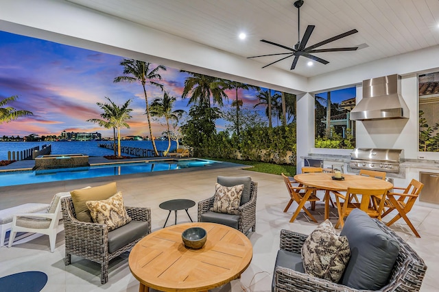 patio terrace at dusk featuring a water view and a grill