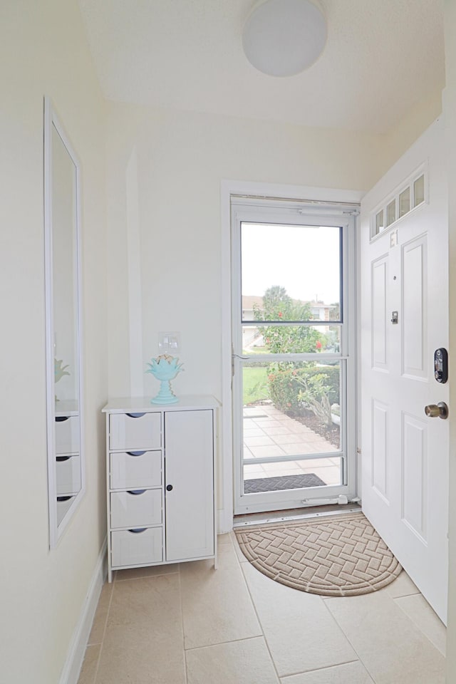 foyer with light tile patterned flooring