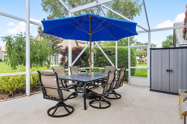 view of patio / terrace featuring glass enclosure