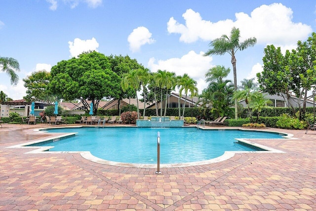 view of swimming pool featuring a patio area