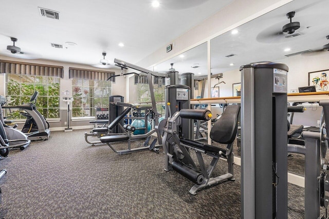 gym with carpet floors and ceiling fan