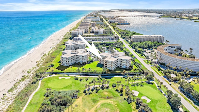 aerial view featuring a water view and a beach view