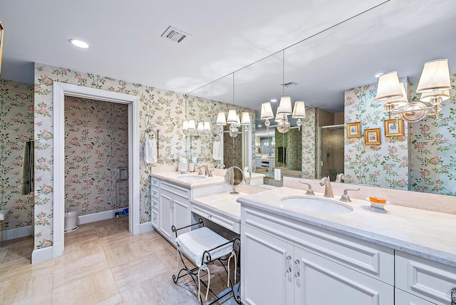 bathroom featuring vanity, tile patterned floors, and a shower with door