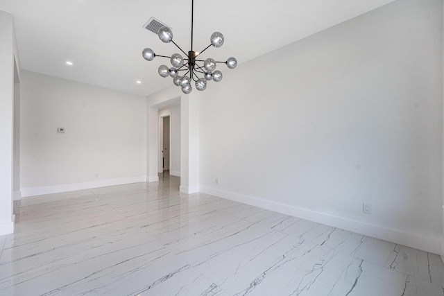 unfurnished room with a notable chandelier