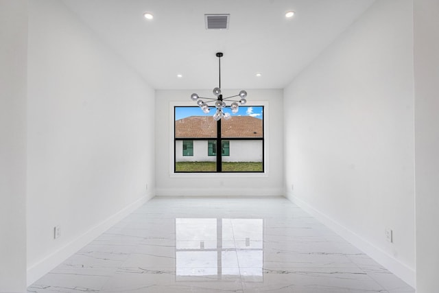 unfurnished dining area featuring an inviting chandelier