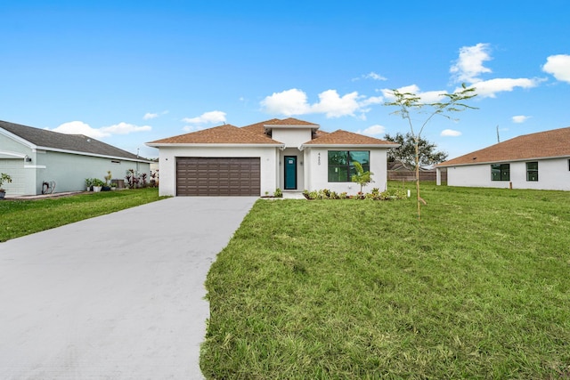 view of front facade with a front yard and a garage