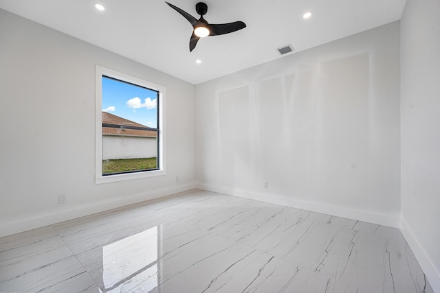 spare room with ceiling fan