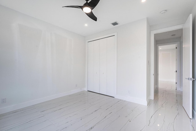 unfurnished bedroom with a closet and ceiling fan