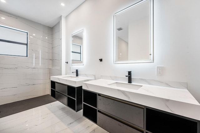 bathroom with vanity and a wealth of natural light