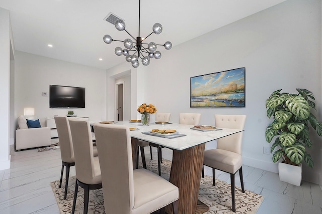 dining space with a chandelier