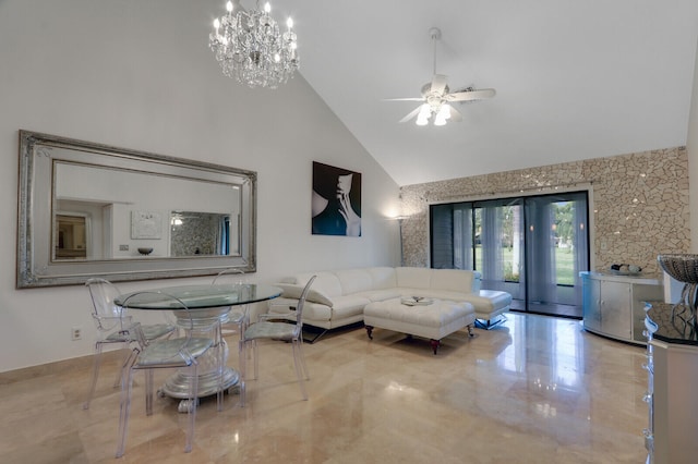 living room with ceiling fan with notable chandelier and high vaulted ceiling