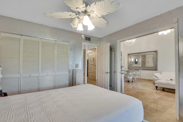 bedroom with ceiling fan and a closet