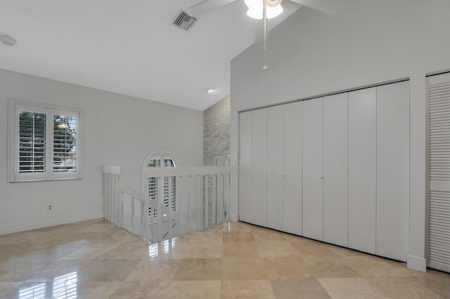 6136 SE Georgetown Pl, Hobe Sound, FL 33455 - unfurnished bedroom featuring high vaulted ceiling, baseboards, and a ceiling fan