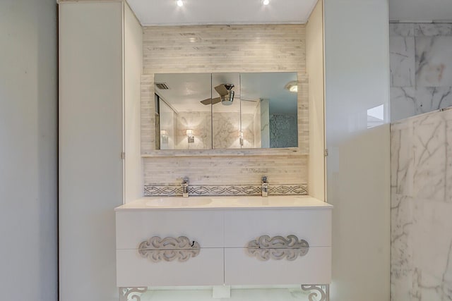 6136 SE Georgetown Pl, Hobe Sound, FL 33455 - bathroom with vanity, a shower, and decorative backsplash