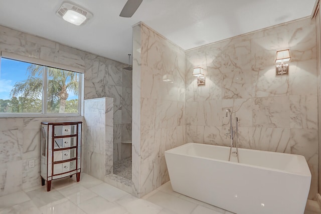 bathroom with separate shower and tub and tile walls