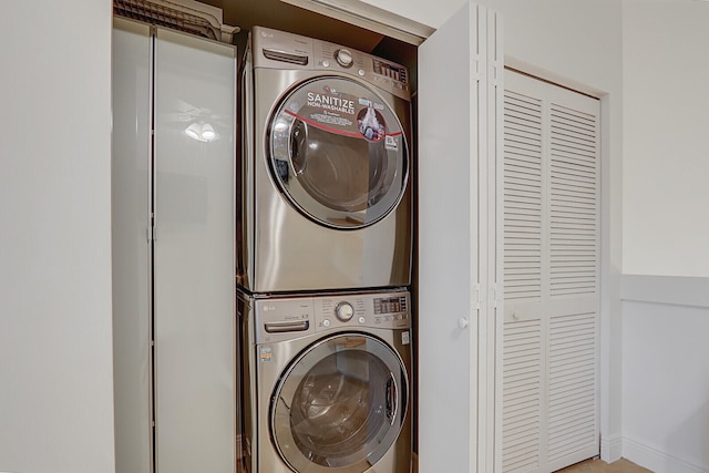 laundry room featuring stacked washing maching and dryer