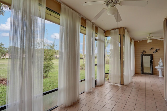 6136 SE Georgetown Pl, Hobe Sound, FL 33455 - unfurnished sunroom with tile patterned flooring and wooden walls
