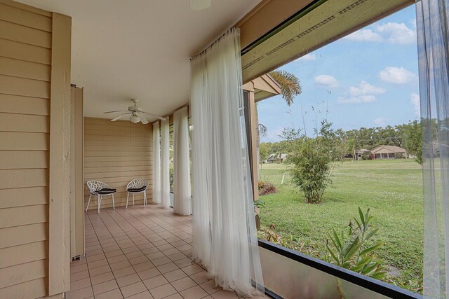 6136 SE Georgetown Pl, Hobe Sound, FL 33455 - unfurnished sunroom with ceiling fan and plenty of natural light