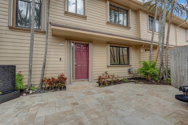 property entrance featuring a patio