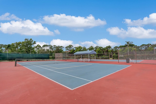 view of sport court with basketball hoop