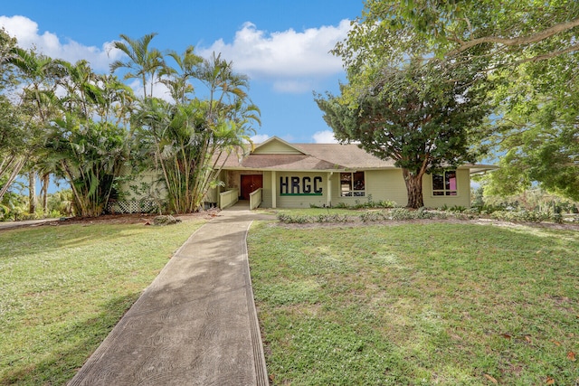 ranch-style house featuring a front lawn