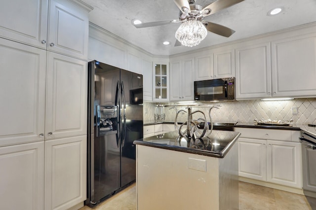 kitchen featuring light tile patterned floors, a kitchen island, tasteful backsplash, white cabinets, and black appliances