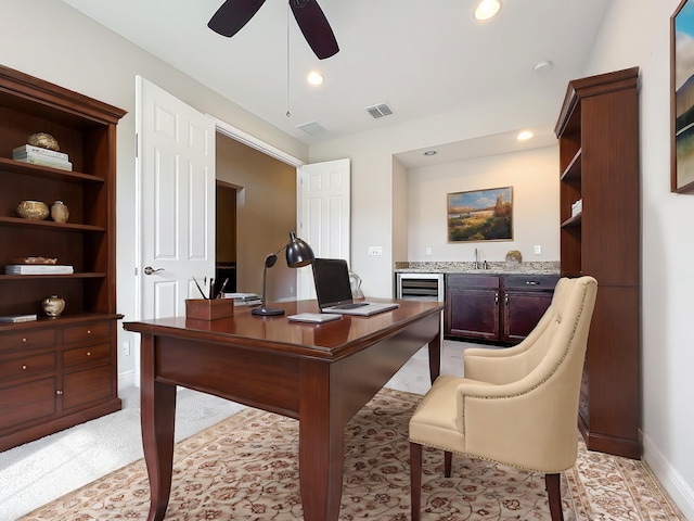 home office with ceiling fan and sink