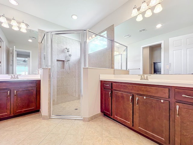 bathroom with tile patterned floors, a healthy amount of sunlight, and an enclosed shower