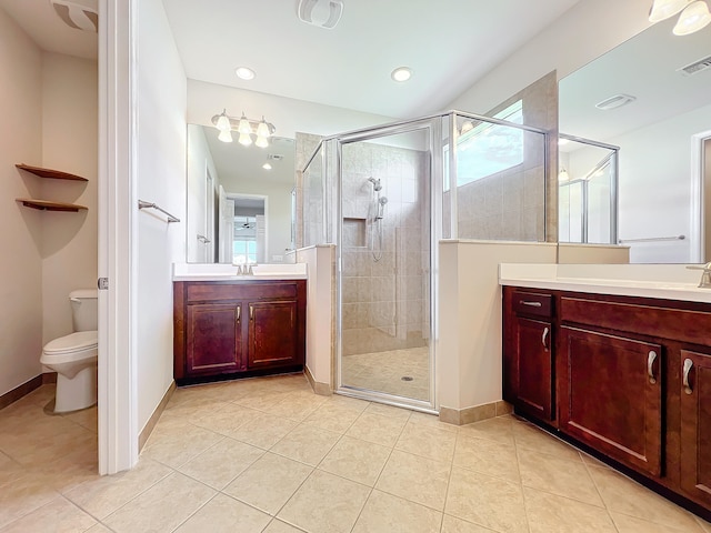 bathroom featuring an enclosed shower, tile patterned floors, toilet, and plenty of natural light