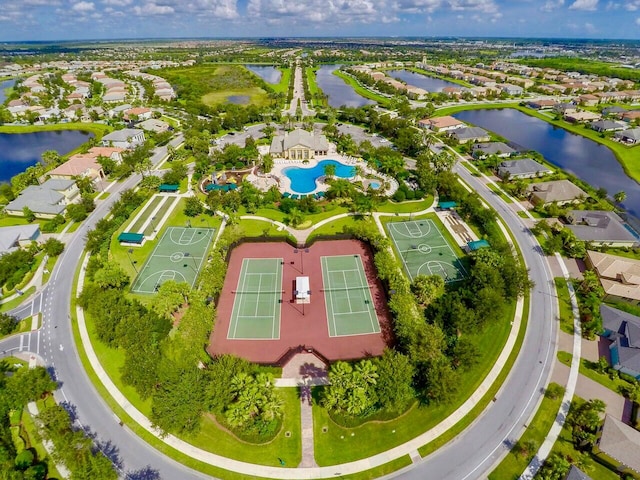 birds eye view of property with a water view