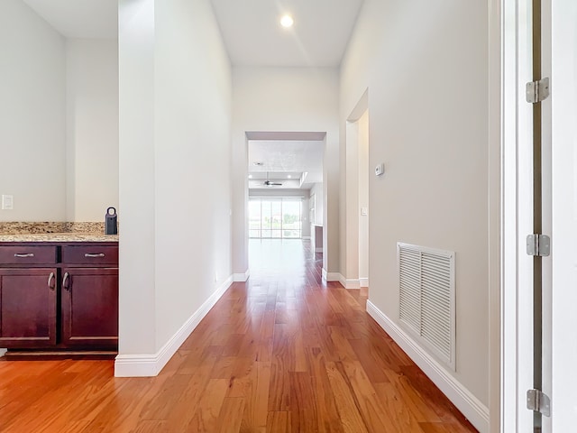 corridor featuring light hardwood / wood-style floors