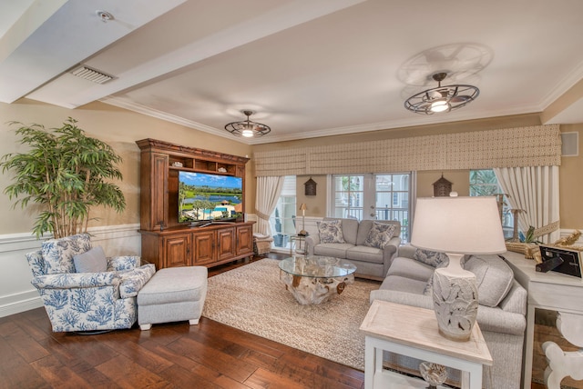 living room featuring dark hardwood / wood-style floors, ceiling fan, and ornamental molding