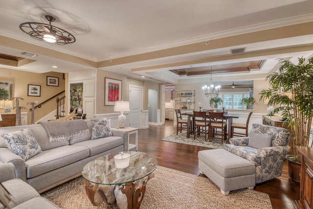 living room featuring a tray ceiling, crown molding, dark hardwood / wood-style floors, and ceiling fan with notable chandelier