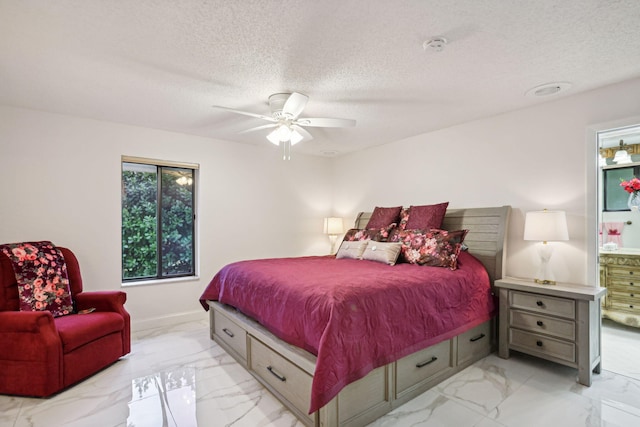 bedroom featuring ceiling fan and a textured ceiling